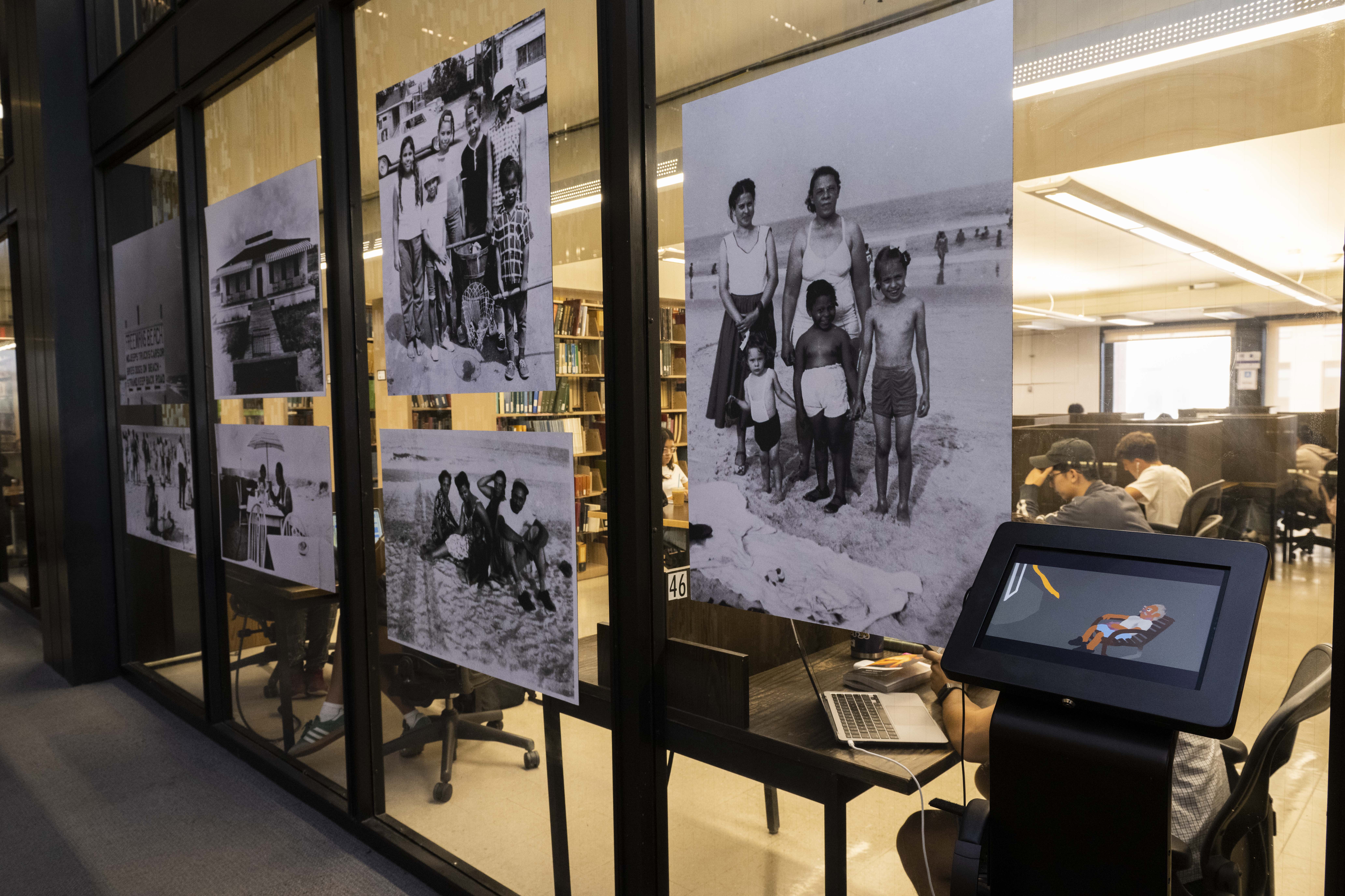 Detail of black and white photos of people with a tablet stand