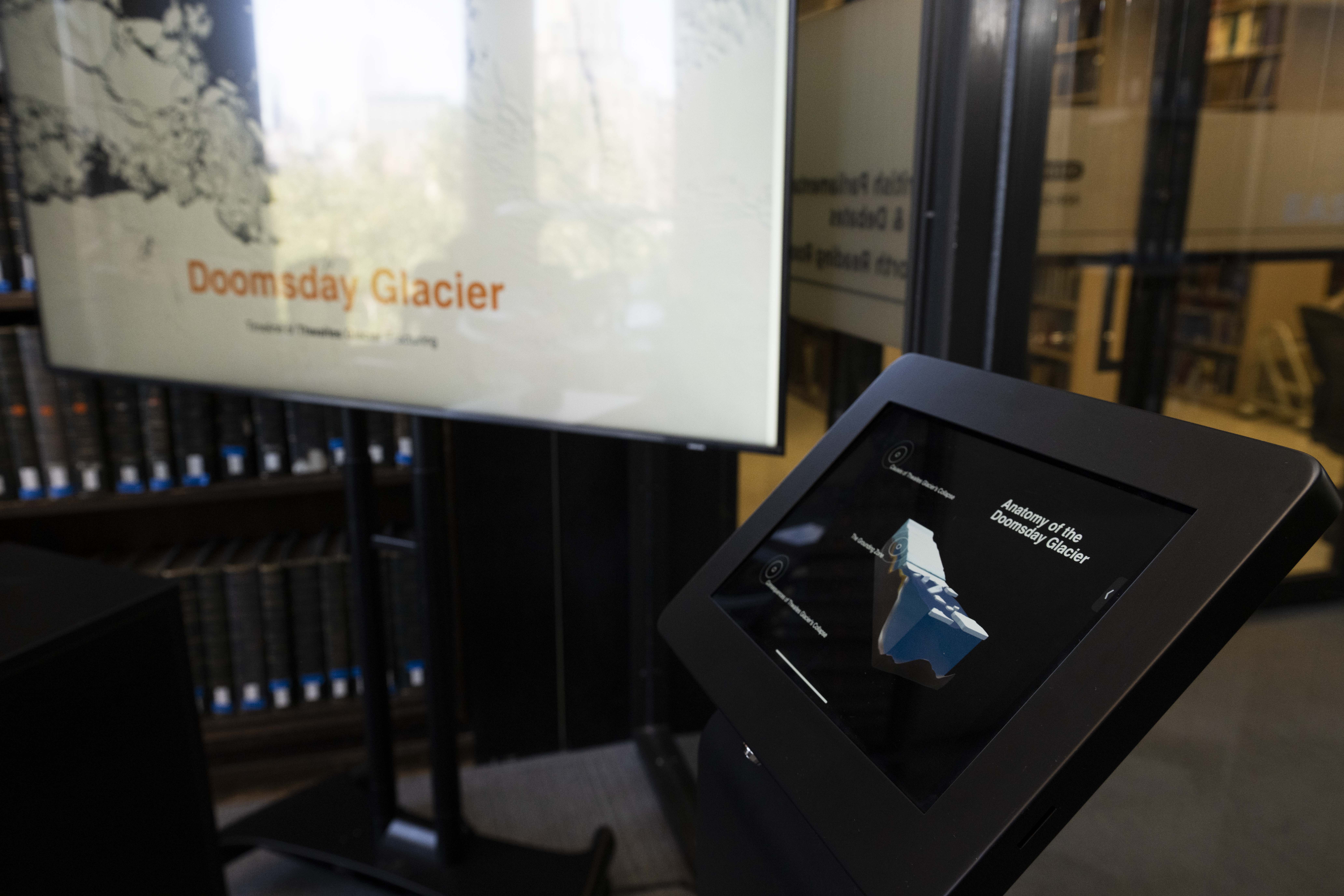 Detail of tablet stand with monitor in background