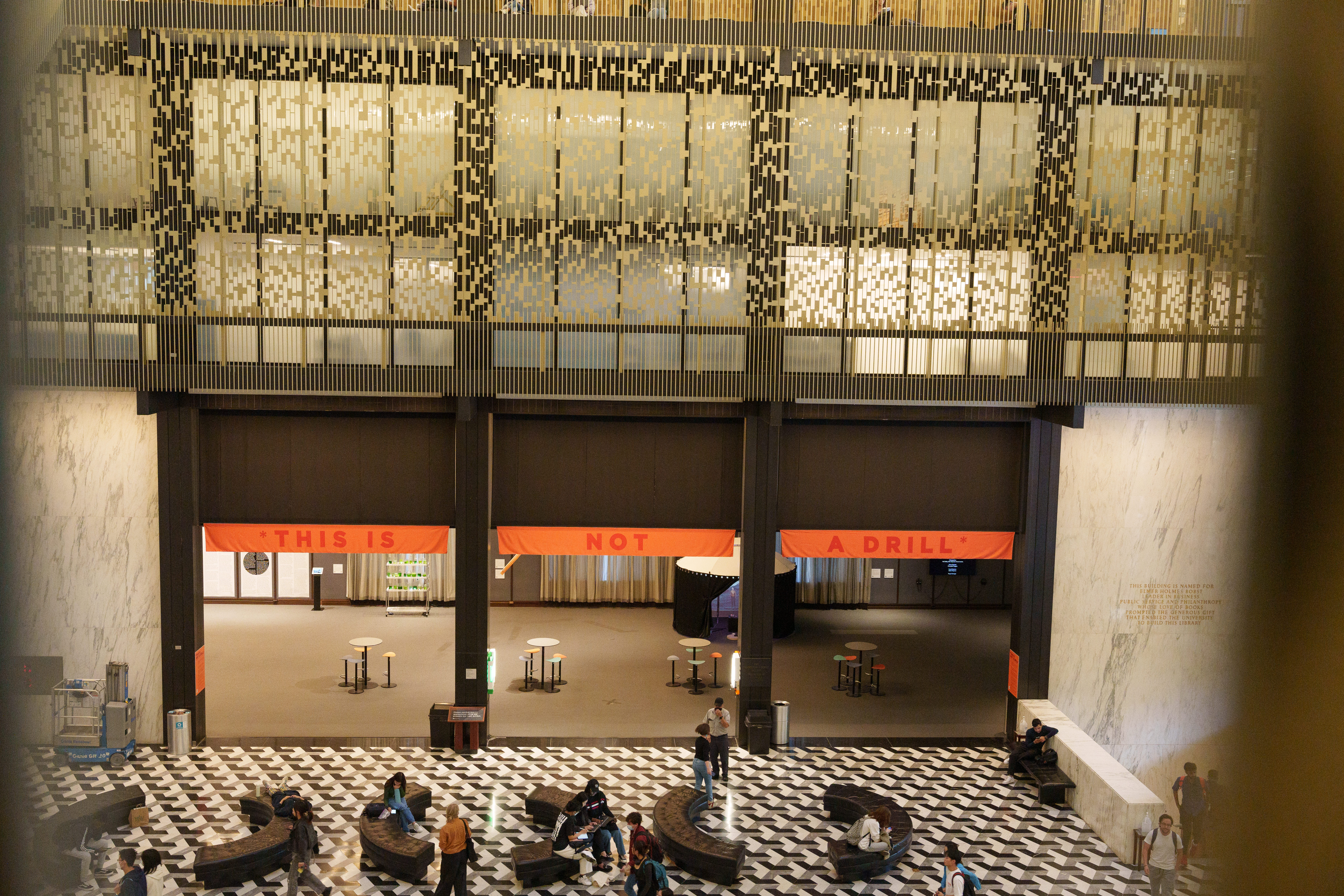 Image of Bobst Gallery featuring *This Is Not A Drill* sign